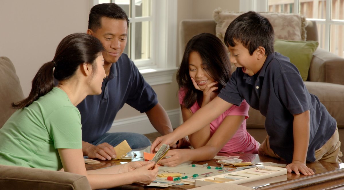 Family playing board games together